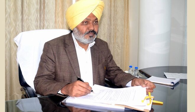 Chandigarh: Punjab Finance Minister Harpal Singh Cheema signs budget copies ahead of the state budget in Chandigarh On Thursday, March 09, 2023. (Photo: Ajay Jalandhari/IANS)